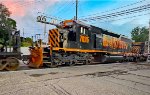 WE 7025 helps pull 120 cars west.